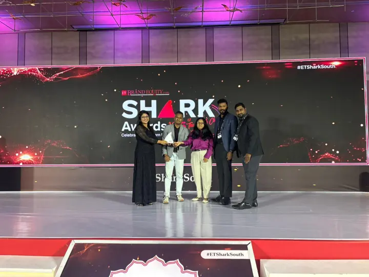 The Century team receiving the ET Shark Award on stage.